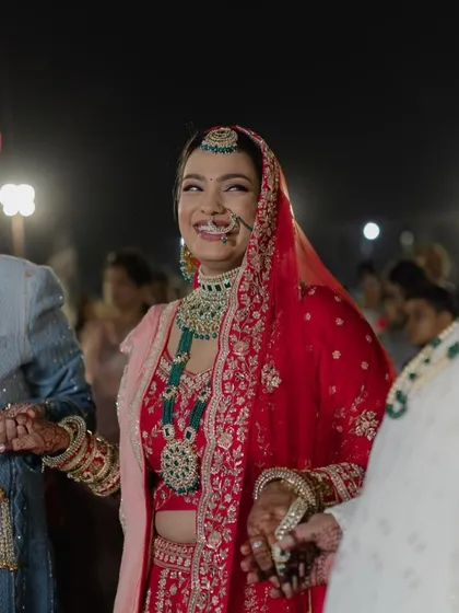 The pure joy on Bhavika's face. Her radiant smile is the best accessory, and her makeup is designed to look flawless even in candid, emotional moments.