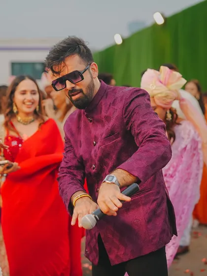Dancing with the guests during the baraat. I don't just stay on the stage; I get into the crowd and dance with everyone.