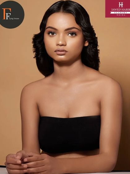 A close-up of the vintage-inspired look, showing the clean makeup and sculpted waves created by our students.