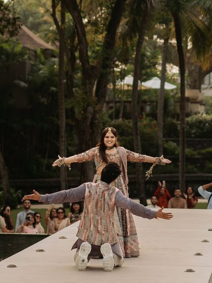 A picture-perfect moment from a destination wedding in Bali. We choreographed this couple's dance to be as beautiful as the scenic backdrop, complete with the iconic SRK pose.