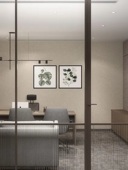 A glimpse into a private cabin at the Hamdard HQ, where biophilic artwork and warm, textured materials create a calm and focused environment. The design balances transparency with privacy through the use of fluted glass.