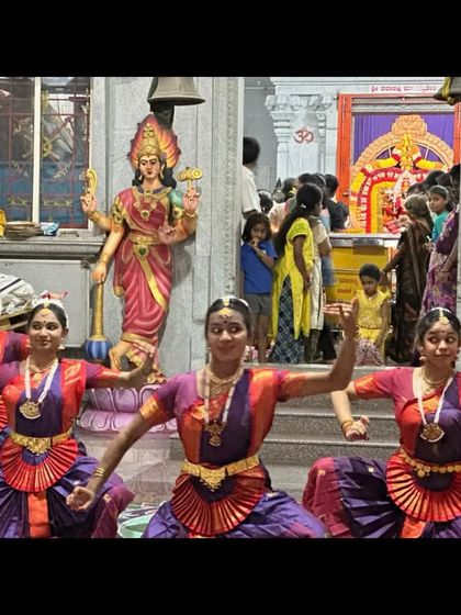 A performance in progress inside the temple hall. We adapt our formations and choreography to fit different spaces, from large stages to intimate temple interiors.