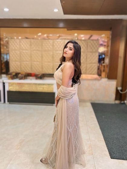 A full-length shot of a client with soft, open waves. This is a versatile and popular choice for wedding guests who want a comfortable yet stylish look.