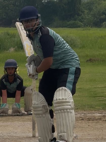 A batsman ready at the crease, with the wicket keeper and slips in position. This is the intensity of a real match situation.