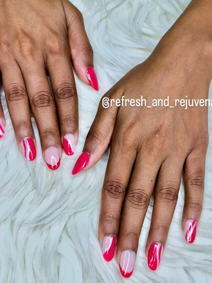A modern and artistic design combining bright pink polish with negative space and abstract white swirls.