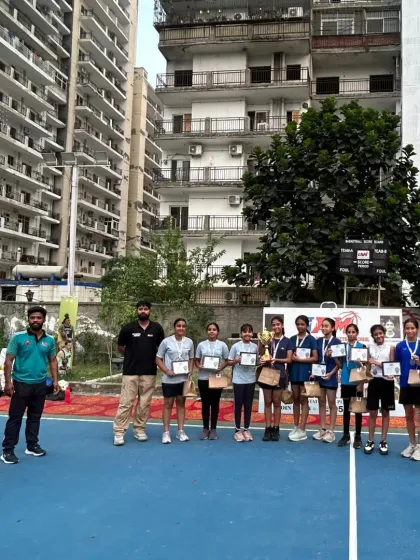 The girls' team posing with their certificates and medals after a successful U-14 league. Every player contributed to this victory.
