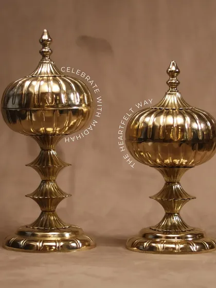 A pair of our Mughal Gold Jars, standing as elegant decorative pieces. They are perfect for serving mukhwaas or dry fruits, adding a touch of royalty to any Eid celebration.