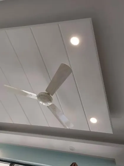 A clean and simple false ceiling design I completed for a 4BHK apartment in Greater Noida. This grooved panel design incorporates recessed spotlights, providing even, unobtrusive illumination for the entire room.