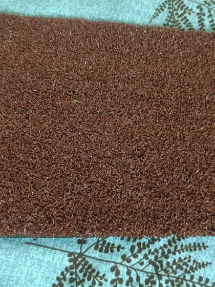 This is a 15mm turf sample in a solid brown color. It's a unique option that can be used for landscaping designs or indoor flooring applications.