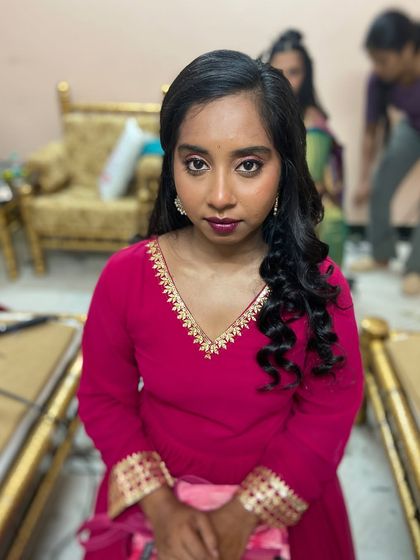 The final look. She is ready for her event, looking confident and beautiful with her party-ready hair and makeup.