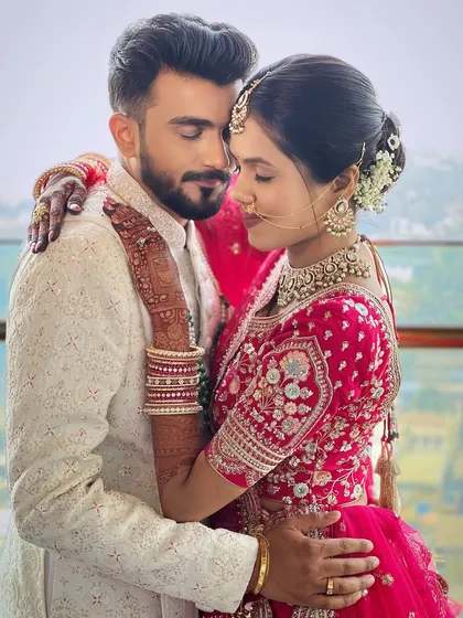 A romantic shot of the couple. The groom's grooming ensures he looks flawless even in close-ups.