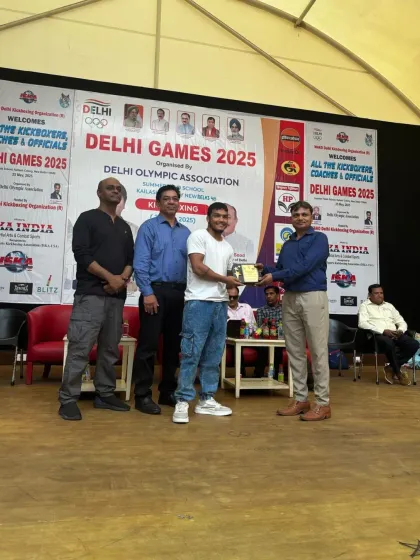Our head coach receiving an award for his contribution to kickboxing at the Delhi Games 2025.