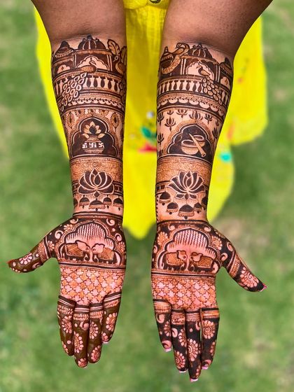 The Bridal Extravaganza package is the epitome of luxury. This design features a dense pattern of elephants, lotuses, and traditional symbols, perfect for the bride who wants the absolute best.