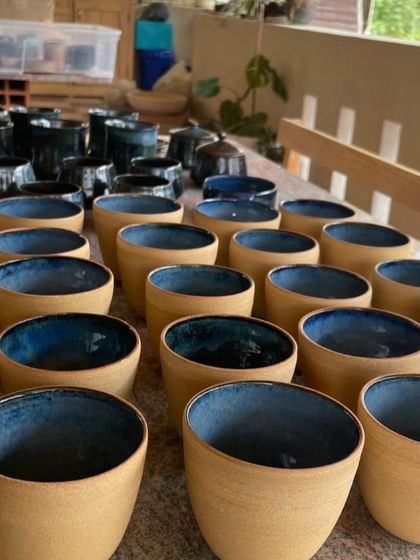 I love the beautiful imperfections that can happen during firing. This batch of stoneware cups and plates came out with a stunning, deep blue glaze that has so much character.
