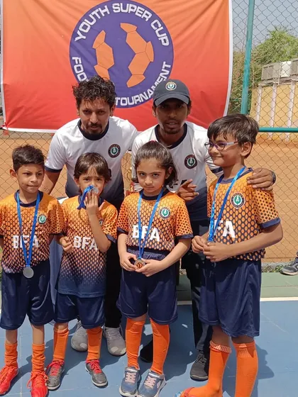 Our team at the Youth Super Cup. Participating in these events provides invaluable experience for our players.