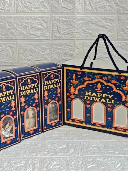 The complete set of the mini Diwali hamper, including three individual boxes and a beautiful matching gift bag.