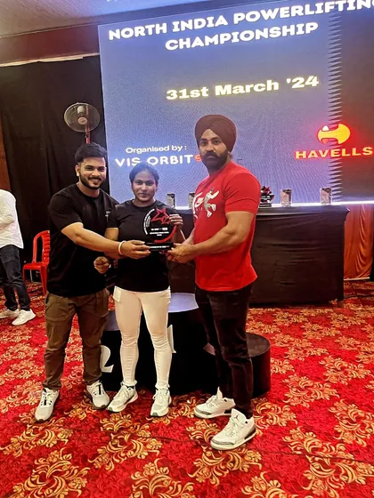 Being awarded the trophy for the heaviest bench press by a senior strong woman at the North India Championship. This was a proud moment for me and my gym, Vis Orbit.