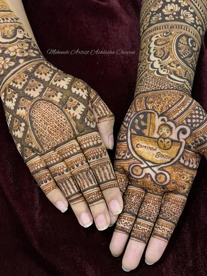 A baby shower mehendi with a "Coming Soon" message and a baby in a stroller. It's a modern and cute way to celebrate the mom-to-be.
