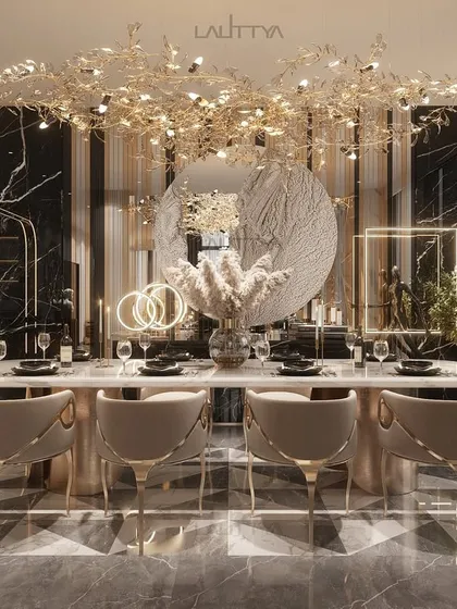 An opulent dining experience defined by a striking black marble floor with geometric inlays and a sculptural gold chandelier. The emerald green artwork adds a bold pop of color, balancing the neutral tones of the chairs.