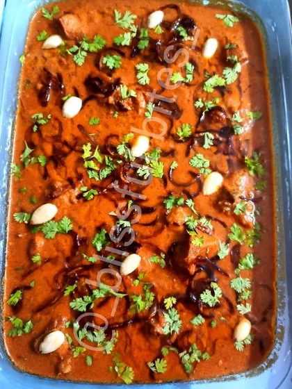 A party-sized tray of Badam Chicken, ready for a celebration. The almonds add a wonderful richness to this special occasion chicken gravy.