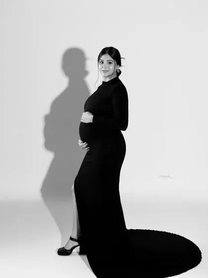 When simplicity meets sophistication, memories are made. The dramatic shadow in this black and white portrait adds an artistic, high-fashion element.
