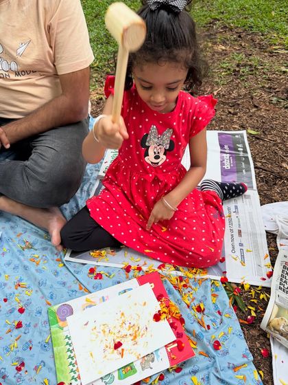 With a wooden mallet in hand, this young artist is discovering the magic of Tatakizome. The focus and joy in her expression capture the essence of our hands-on sensory activities for children.
