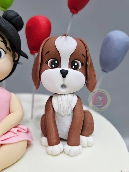 A close-up of the adorable fondant dog made for a little girl's second birthday cake.
