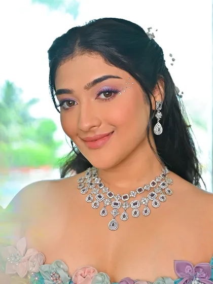 A touch of sparkle on the inner corner of the eye adds to the magical feel of this look. It's a small detail that makes a big impact.