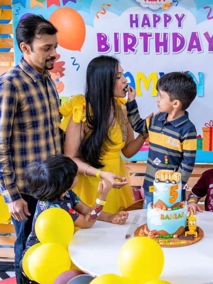 A sweet moment where mom feeds Damian the first bite of his special 5th birthday cake.