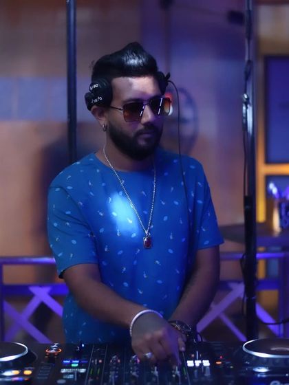 A serious look while mixing, ensuring the sound is perfect.