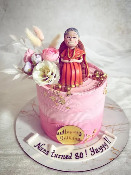 A special cake for a grandmother turning 80, complete with a custom-made sugar figurine of her. It's the personal touches that make a cake a memory.