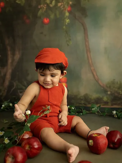A quiet, contemplative moment as the baby inspects a flower. I always make sure to capture a range of expressions, from big smiles to gentle curiosity.