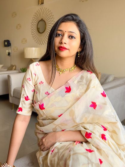 My Subho Bijoya look! For the final day of Durga Puja, I chose this modern Dhakai Jamdani saree with a lotus motif, sticking to the traditional white and red theme in a contemporary way.