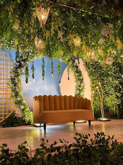 We brought an enchanted forest to life with this magical stage setup. A canopy of lush greenery, hanging lights, and whimsical details created a dreamy, immersive atmosphere for the couple and their guests.
