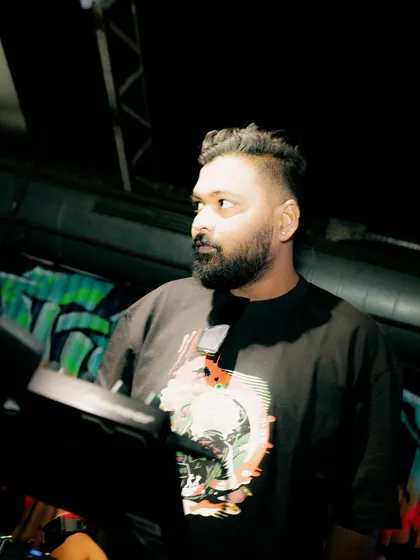 Looking out at the crowd during a set. Reading the room is key to keeping the energy right.