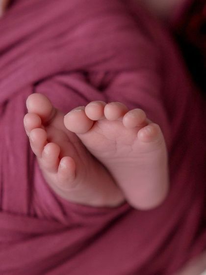 The tiniest footprints. A close-up on the feet of a swaddled baby is a must-have shot to remember how small they once were.