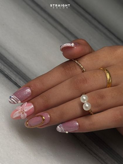 A side view highlighting the 3D flower and gold detailing. I build these elements carefully to ensure they are both beautiful and durable, adding a touch of luxury to your manicure.