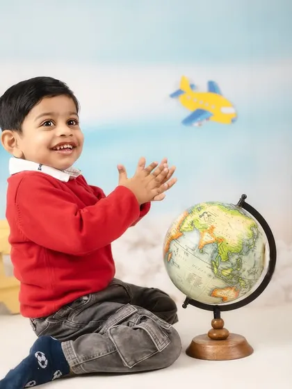 Planning his next big trip around the globe. The pilot and traveler theme is wonderful for capturing a child's sense of wonder and excitement.