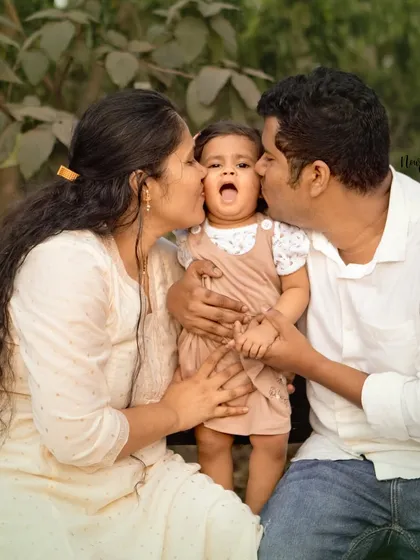 This is what it's all about. We live for these unposed, candid family moments where the love is so real you can feel it. A perfect memory from a first birthday photoshoot.