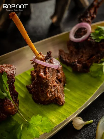 My Mutton Lamp Chops are a true indulgence. Marinated in a blend of bold spices and cooked until perfectly tender, they are served on a banana leaf for an authentic touch.