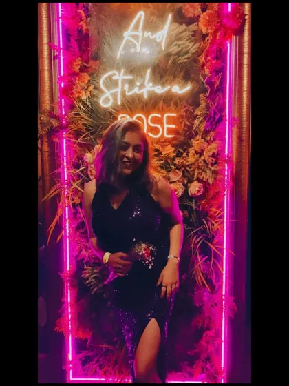 Another pose in front of the neon sign. This look is perfect for freshers' parties, cocktail nights, or any glamorous event.
