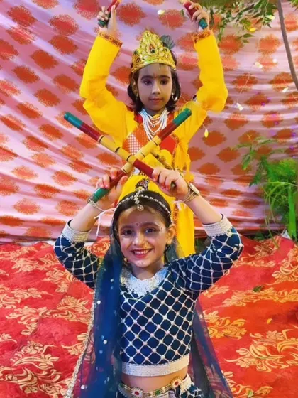 We love celebrating our culture with special themed performances. Here, our talented students are dressed as Radha and Krishna for a Janmashtami dandiya dance, creating beautiful memories while learning.