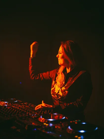 A candid shot of me feeling the music during a set. These are the moments of pure joy that I share with the audience.