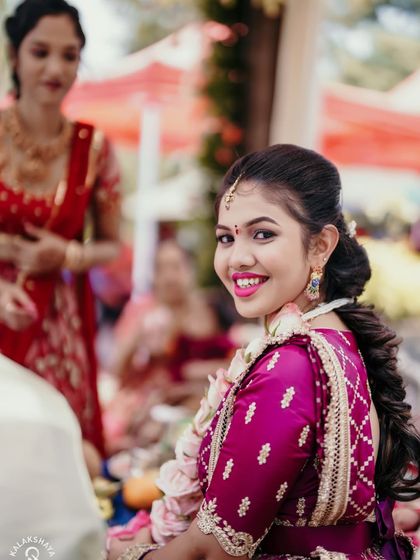 A bright and happy bride looking over her shoulder with a beautiful smile.