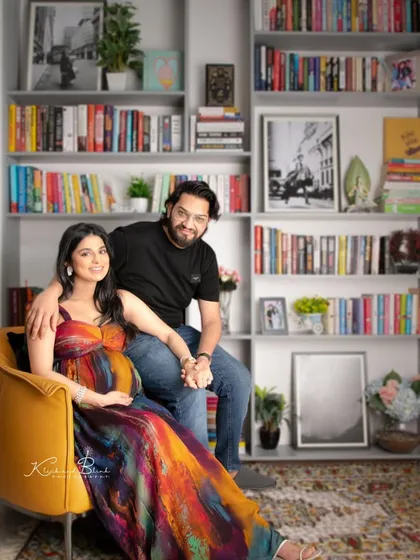 Your home tells a story, making it a perfect location for a maternity shoot. The bookshelf backdrop added a personal and intellectual touch to this couple's warm and loving portraits.