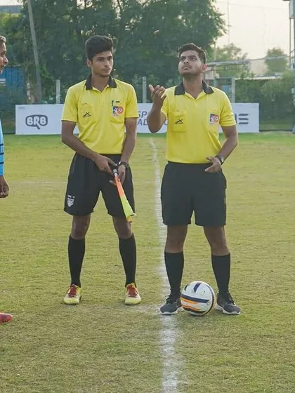 The coin toss before a league match. Our captains ready to lead their teams into battle.