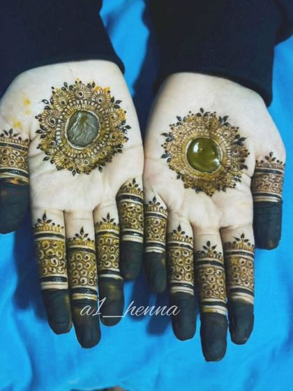 A classic mandala design with detailed finger work and filled tips.