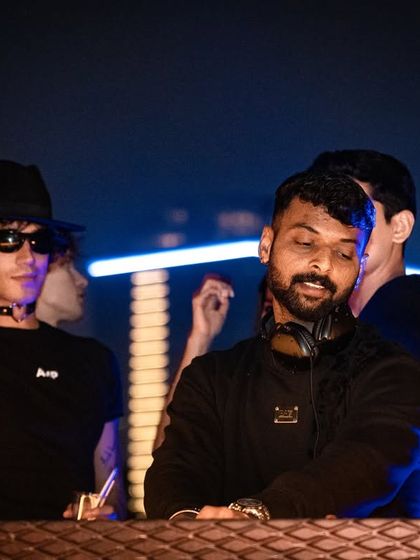 Feeling the music and the crowd's energy. A great shot with a fellow partygoer enjoying the vibe.