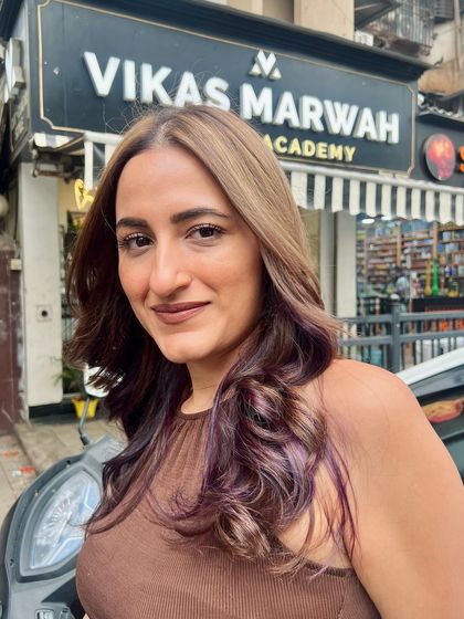 The client showing off her new look outside my salon. A great hairstyle should look just as good on the street as it does in the salon chair.