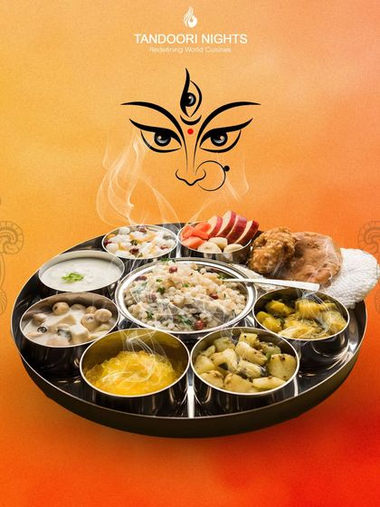 A complete Navratri thali, celebrating the essence of the festival. This platter features a variety of onion and garlic-free dishes, from curries and vegetables to sweets and fruits.